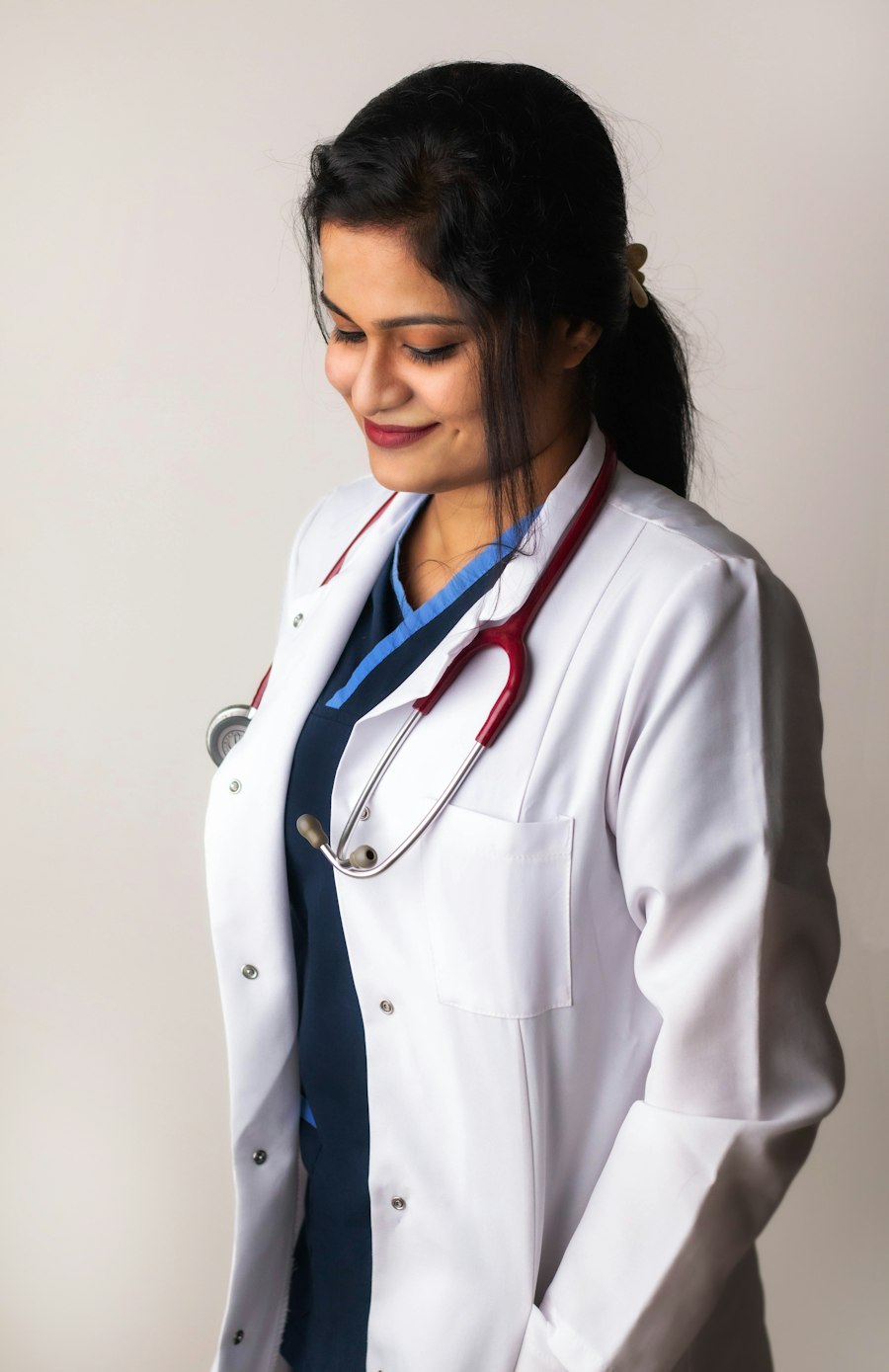 A smiling female doctor in a white coat
